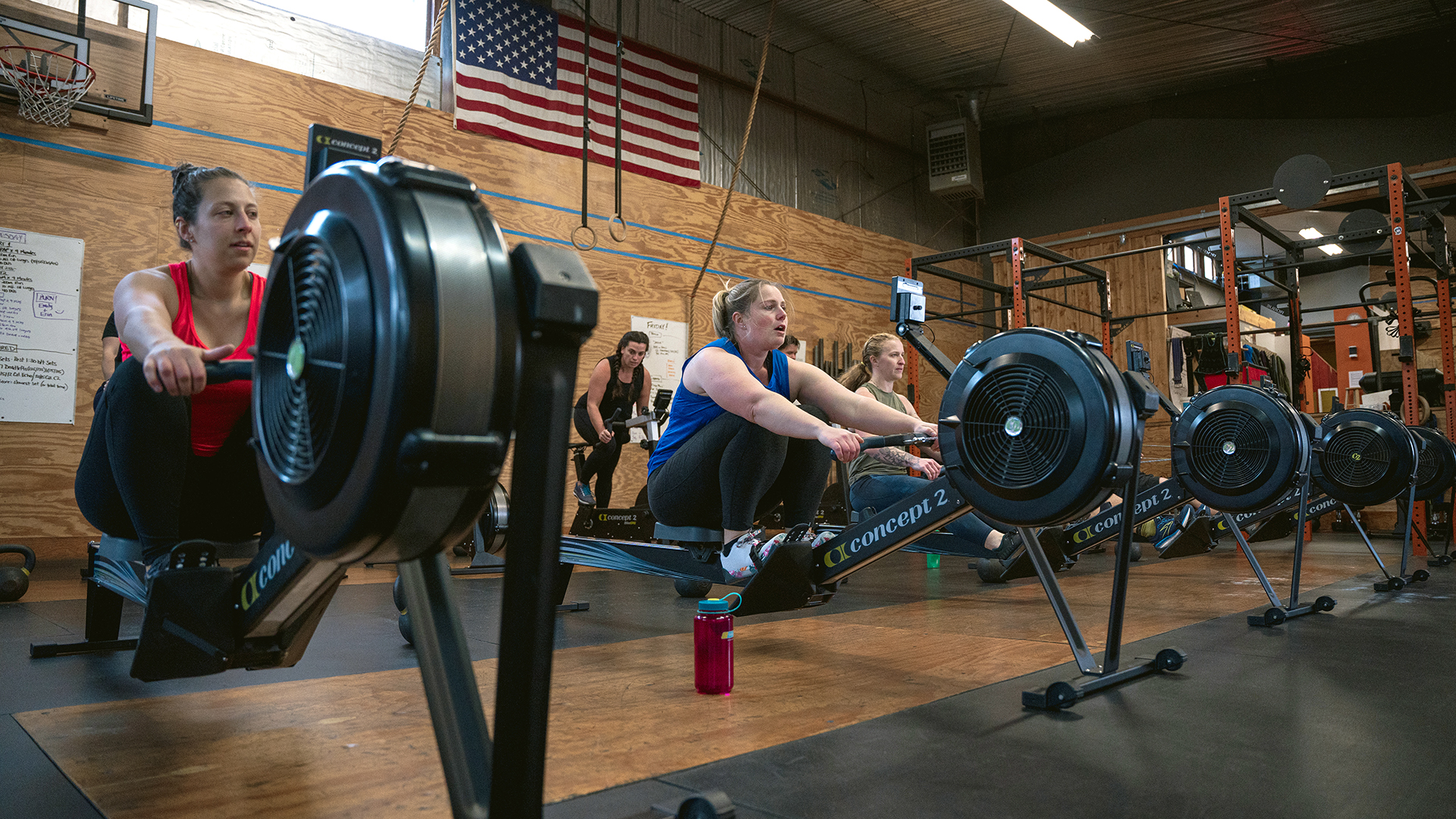 Class of people working out on the RowErg