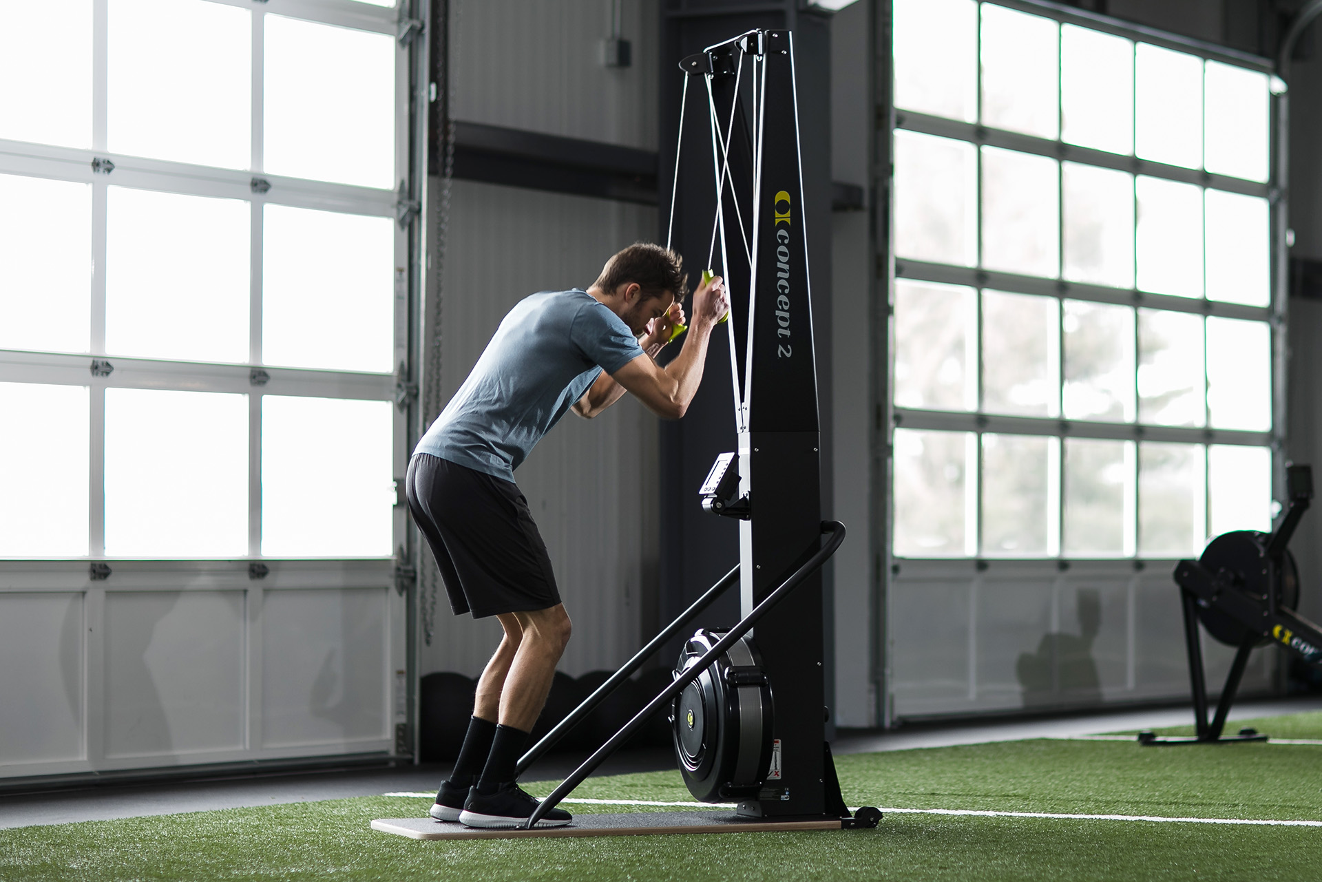 Man skiing on the SkiErg using good technique