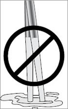 Image of oars with wooden handles resting on the ground. 