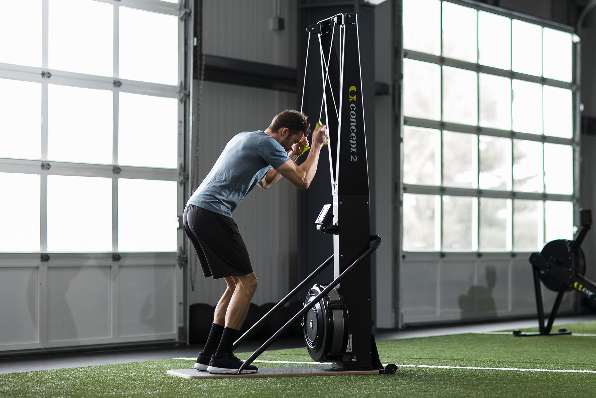 Man skiing on the SkiErg using good technique